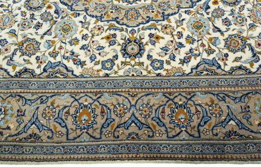 Corner detail of 2000s Kashan rug showing border pattern and Wool pile