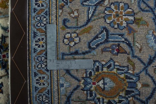 Backside of handmade 2000s Kashan rug showing knot structure and weave density