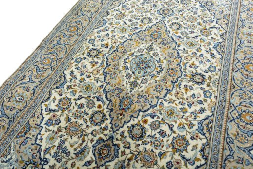 Backside of handmade 2000s Kashan rug showing knot structure and weave density