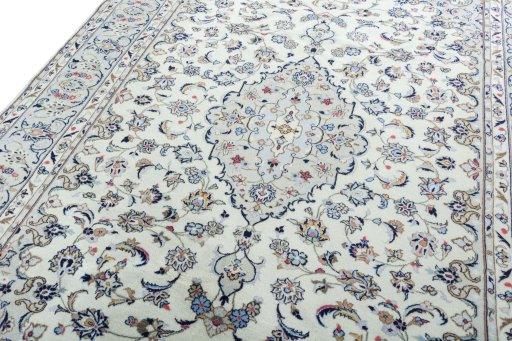 Backside of handmade 2000s Kashan rug showing knot structure and weave density
