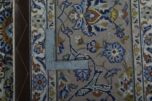 Backside of handmade 2000s Kashan rug showing knot structure and weave density