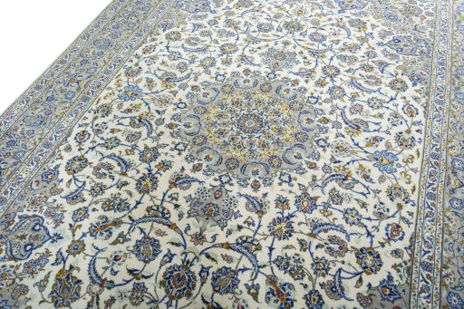 Backside of handmade 2000s Kashan rug showing knot structure and weave density