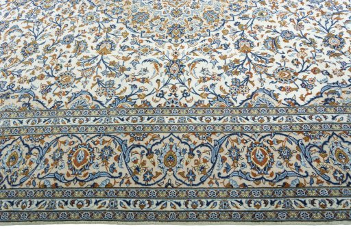 Corner detail of 2000s Kashan rug showing border pattern and Wool pile