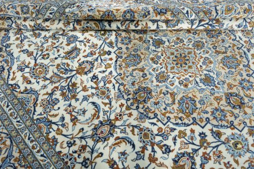 Close-up detail of 2000s Kashan rug from Iran / Persia showing Wool weave