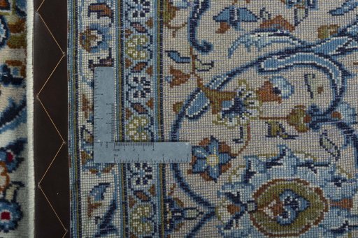 Backside of handmade 2000s Kashan rug showing knot structure and weave density