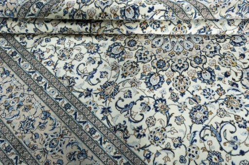 Close-up detail of 2000s Kashan rug from Iran / Persia showing Wool weave
