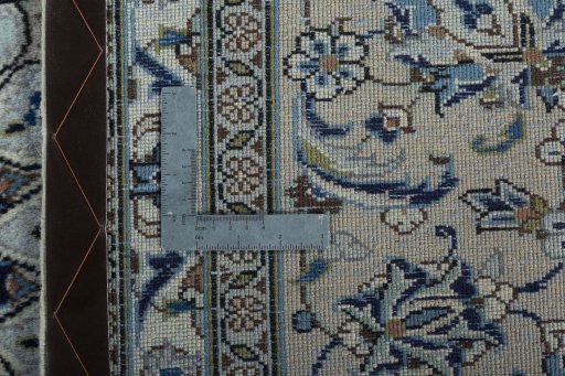 Backside of handmade 2000s Kashan rug showing knot structure and weave density