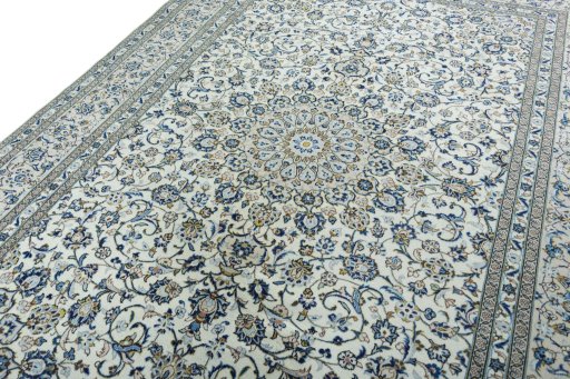 Backside of handmade 2000s Kashan rug showing knot structure and weave density