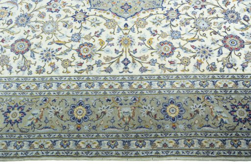Corner detail of 2000s Kashan rug showing border pattern and Cork pile