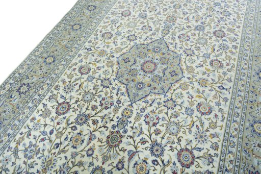 Backside of handmade 2000s Kashan rug showing knot structure and weave density