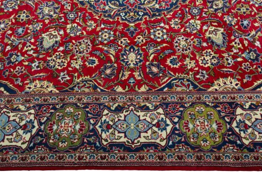 Corner detail of 2000s Kashan rug showing border pattern and Wool pile