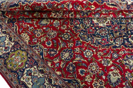 Close-up detail of 2000s Kashan rug from Iran / Persia showing Wool weave