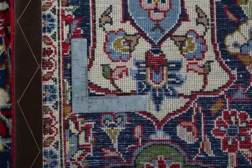 Backside of handmade 2000s Kashan rug showing knot structure and weave density