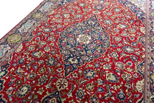 Backside of handmade 2000s Kashan rug showing knot structure and weave density