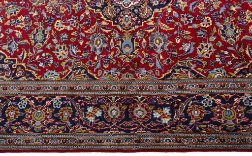 Corner detail of New Kashan rug showing border pattern and Cork pile