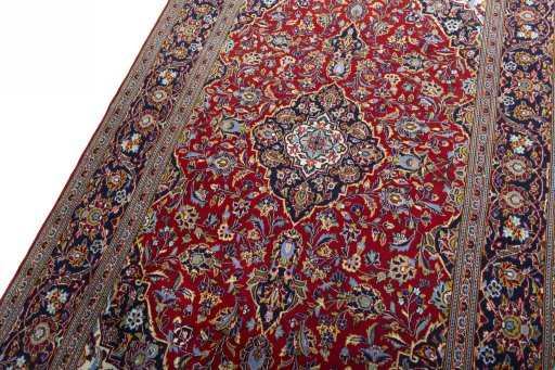 Backside of handmade New Kashan rug showing knot structure and weave density