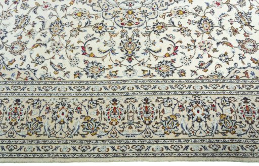 Corner detail of New Kashan rug showing border pattern and Wool pile