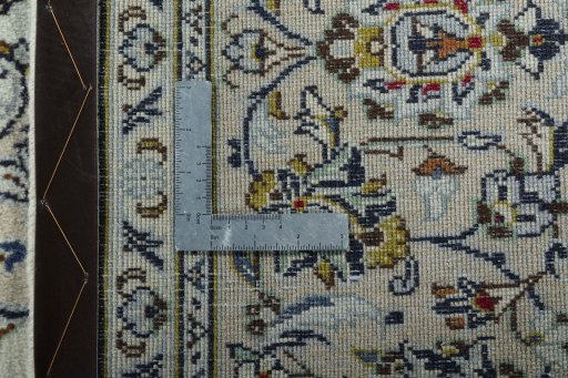 Backside of handmade New Kashan rug showing knot structure and weave density
