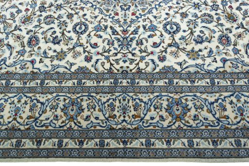 Corner detail of New Kashan rug showing border pattern and Wool pile