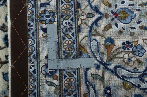 Backside of handmade New Kashan rug showing knot structure and weave density