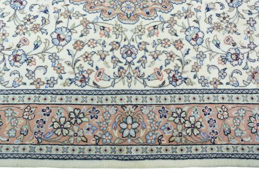 Corner detail of New Kashan rug showing border pattern and Wool pile