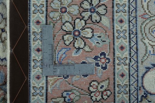 Backside of handmade New Kashan rug showing knot structure and weave density
