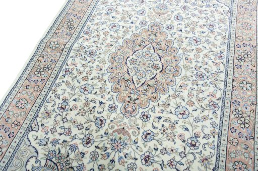 Backside of handmade New Kashan rug showing knot structure and weave density
