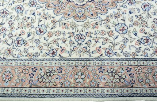 Corner detail of New Kashan rug showing border pattern and Wool pile