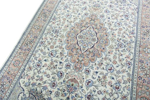 Backside of handmade New Kashan rug showing knot structure and weave density