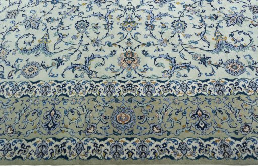 Corner detail of 2000s Kashan rug showing border pattern and Wool pile