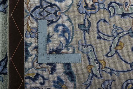 Backside of handmade 2000s Kashan rug showing knot structure and weave density