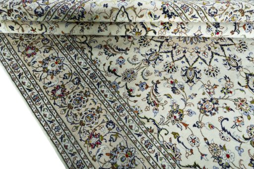 Close-up detail of 2000s Kashan rug from Iran / Persia showing Wool weave