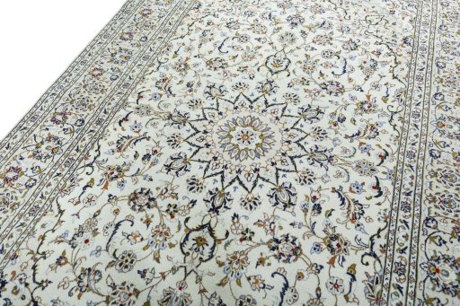 Backside of handmade 2000s Kashan rug showing knot structure and weave density
