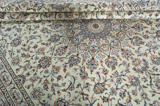 Close-up detail of 2000s Kashan rug from Iran / Persia showing Wool weave