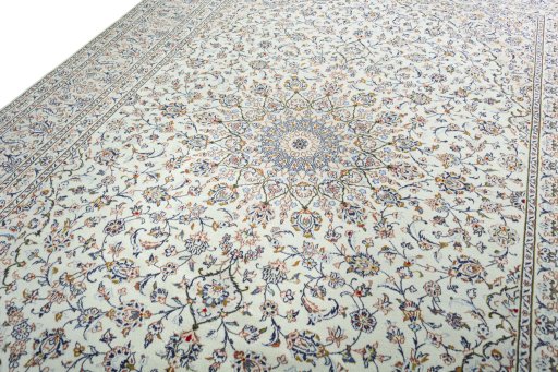Backside of handmade 2000s Kashan rug showing knot structure and weave density