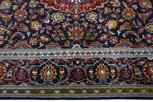 Corner detail of New Kashan rug showing border pattern and Cork pile