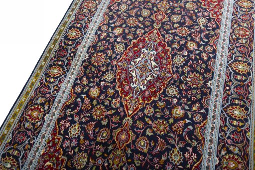 Backside of handmade New Kashan rug showing knot structure and weave density