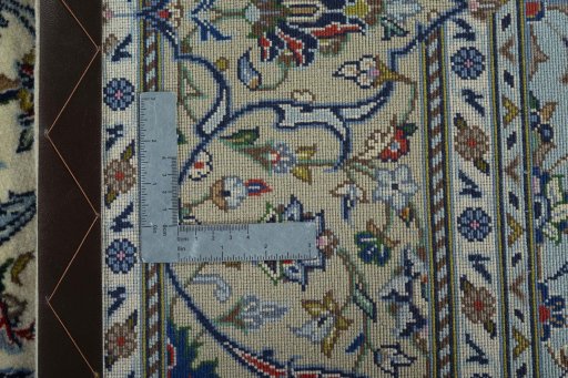 Backside of handmade New Kashan rug showing knot structure and weave density