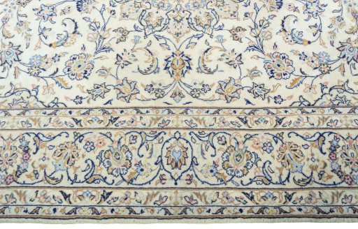 Corner detail of New Kashan rug showing border pattern and Wool pile