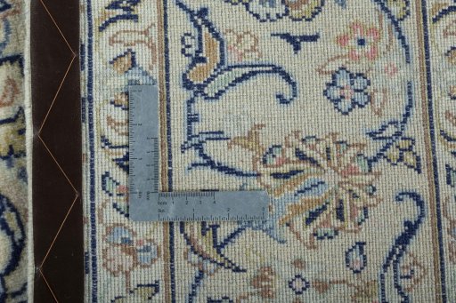Backside of handmade New Kashan rug showing knot structure and weave density