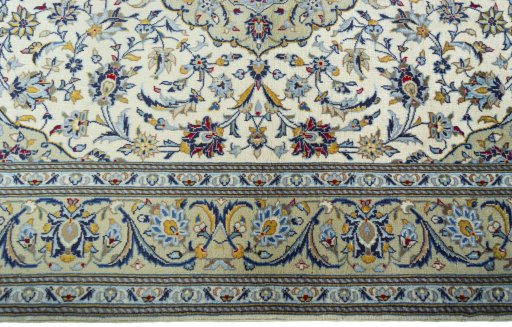Corner detail of New Kashan rug showing border pattern and Cork pile