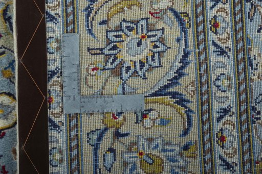 Backside of handmade New Kashan rug showing knot structure and weave density