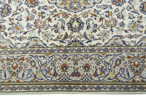 Corner detail of 1970s Kashan rug showing border pattern and Wool pile