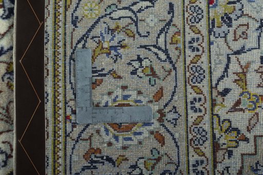 Backside of handmade 1970s Kashan rug showing knot structure and weave density