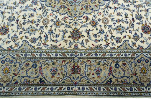Corner detail of New Kashan rug showing border pattern and Cork pile