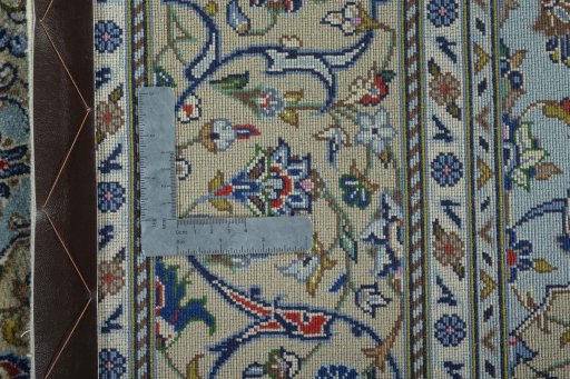 Backside of handmade New Kashan rug showing knot structure and weave density