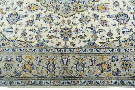 Corner detail of New Kashan rug showing border pattern and Cork pile