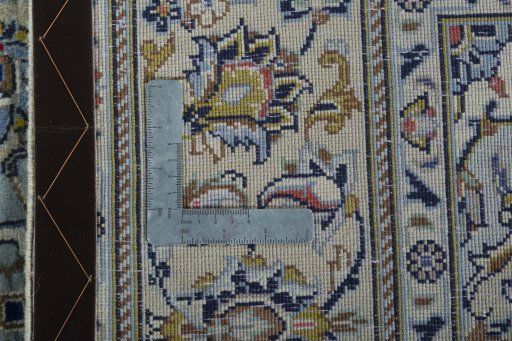 Backside of handmade New Kashan rug showing knot structure and weave density