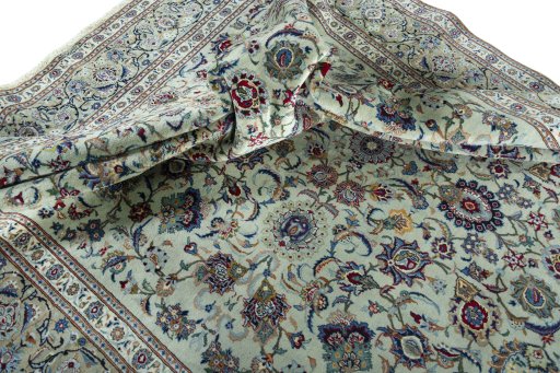 Surface texture of 1950s Kashan rug with natural Cork and intricate pattern