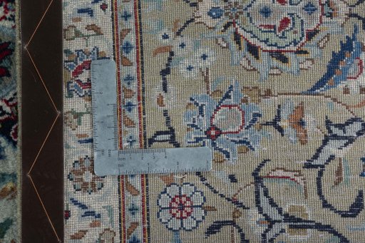Backside of handmade 1950s Kashan rug showing knot structure and weave density